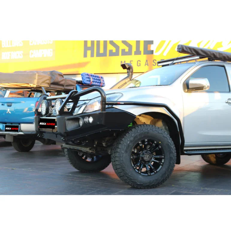 Off-road vehicles with aftermarket bumpers and tires featuring Rockarmor Brushbar for Isuzu Dmax