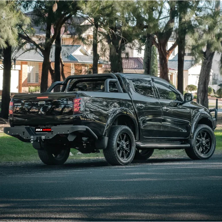 Black pickup truck with roll bar showing the rear step tow bar for Mitsubishi Triton MQ