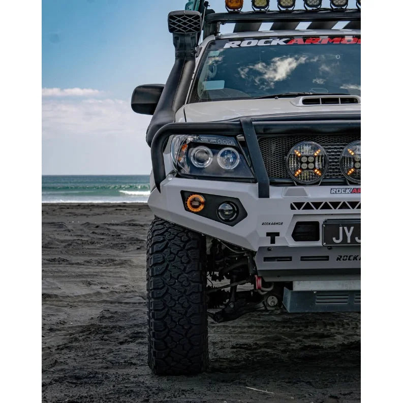 Modified white off-road vehicle featuring Hoop Steel Bullbar for maximum frontal protection