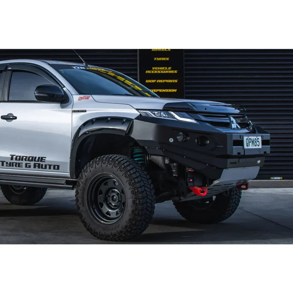 Silver Mitsubishi mr triton pickup truck equipped with Rockarmor gt steel hoopless bullbar combo pack with black front bumper