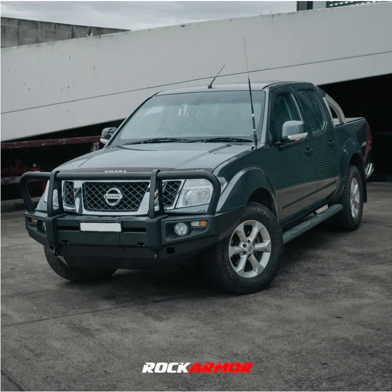 Dark green Nissan Navara pickup with premium steel bullbar for D40 and Pathfinder R51