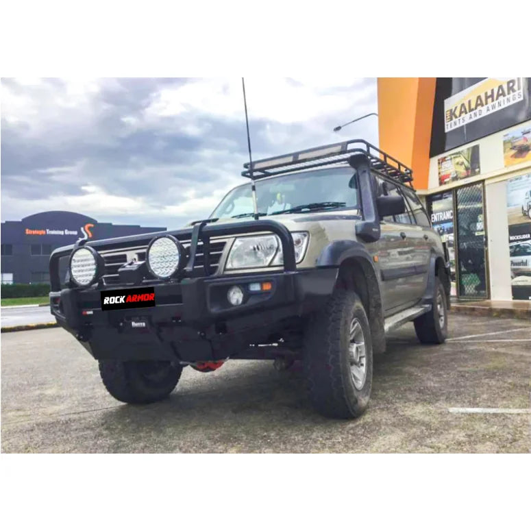 Modified off-road vehicle featuring Rockarmor premium steel bullbar with fog lights installation