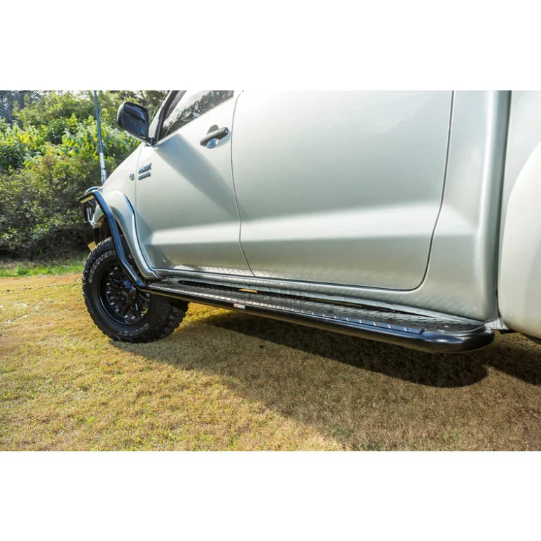 Silver toyota hilux n70 fitted with rockarmor steel rockslider checker plate step side steps 2005-2015 model