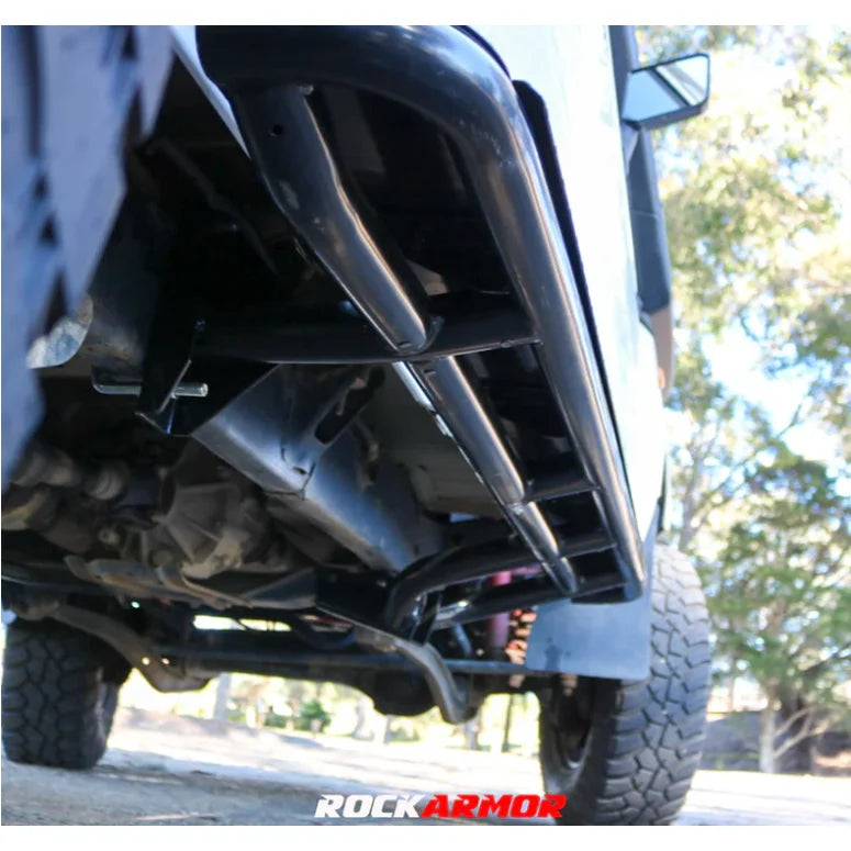Black rockarmor steel rockslider side steps in steel checker plate fitted on rear of toyota landcruiser 78 series v8 troop carrier